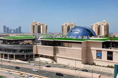 a large building with a blue dome on top of it at Private Beach Palm Jumeirah Studio high floor in Dubai