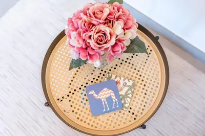 a vase with a pink flower on a table at Best Place 2B Dubai in Dubai