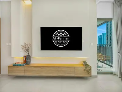 a firm logo on a wall in a living room at Premium Two-Bedroom Apartment with Private Balcony & Full Burj Khalifa Views by Al Fannan Holiday Homes in Dubai