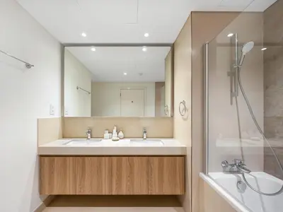 a bathroom with a sink and a mirror at Premium Two-Bedroom Apartment with Private Balcony & Full Burj Khalifa Views by Al Fannan Holiday Homes in Dubai