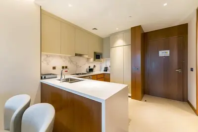 a kitchen with a sink and a counter top at FAM Living - Address Residences Opera - Luxurious 2Bed in Dubai