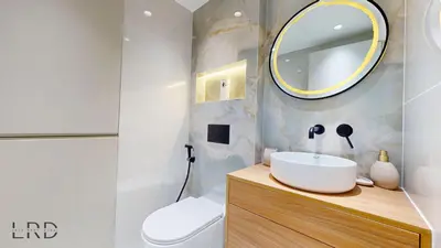 a bathroom with a sink and a mirror at Luxurious Apartment with Marina Views in Dubai