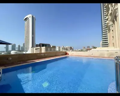 a large swimming pool on the roof of a building at Stunning SeaView Elite Residence Dubai Marina in Dubai