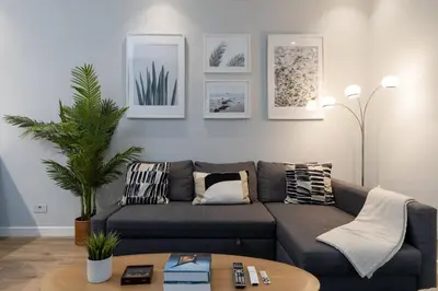 a living room with a couch and a table at Lovey Unique Property- Garden and Barbeque Area in Dubai