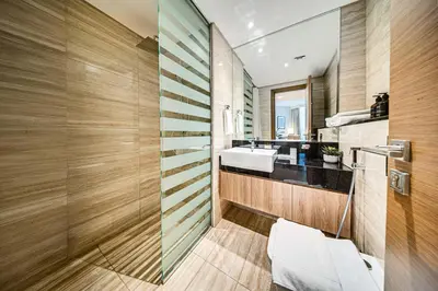 a bathroom with a sink and a mirror at Wonderful New Studio in Missoni Business Bay in Dubai