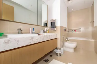 a bathroom with a sink and a toilet at 3 BR Dubai Creek Harbour in Dubai