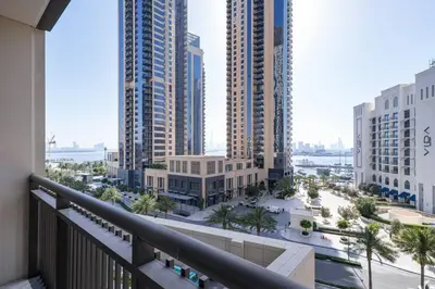 a balcony with a view of a city with tall buildings at 3 BR Dubai Creek Harbour in Dubai