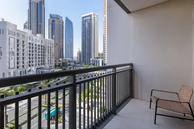a balcony with a chair and a view of the city at 3 BR Dubai Creek Harbour in Dubai