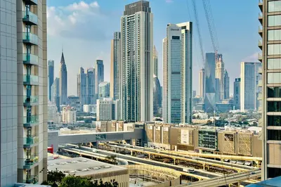 a view of a city skyline with tall buildings at Vserve - 1 BR Iconic Burj Khalifa full view in Dubai