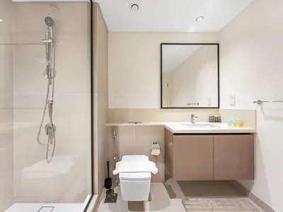 a bathroom with a shower and a toilet and a sink at Luxury Downtown Dubai Apartment - 5 Mins Walk to Burj, Opera, Dubai Mall, Sleep 1-10 in Dubai