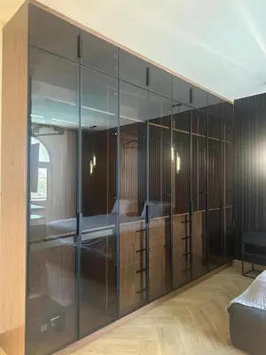 a room with glass cabinets with a bed in it at Luxurious Villa 5BHK with Pool BBQ and Full Time Housemaid Assistance - live in in Dubai