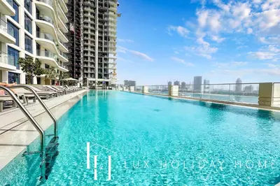 a swimming pool on the roof of a building at LUX The Marina Vista Beachfront Suite 4 in Dubai