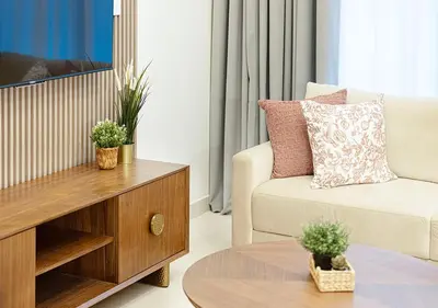 a living room with a couch and a coffee table at Stylish Downtown Retreat, Burj Crown, Opera & Boulevard View in Dubai