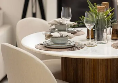 a table with plates and wine glasses on it at Stylish Downtown Retreat, Burj Crown, Opera & Boulevard View in Dubai
