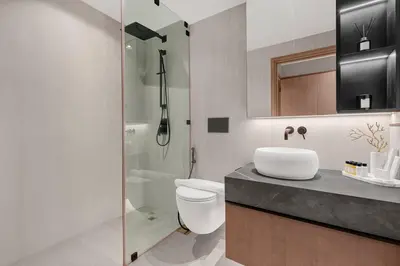 a bathroom with a shower and a toilet and a sink at FIRST CLASS 1BR Breathtaking Downtown View in Dubai