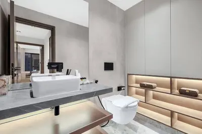a bathroom with a white sink and a toilet at FIRST CLASS 1BR Breathtaking Downtown View in Dubai