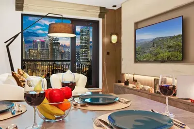 a table with glasses of wine and fruit on it at FIRST CLASS 1BR Breathtaking Downtown View in Dubai
