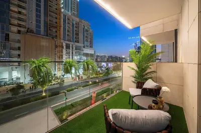 a balcony with a view of a city at FIRST CLASS 3BR Lively Sanctuary in Dubai
