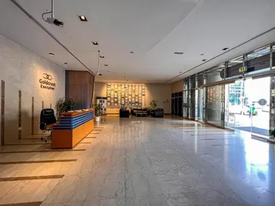 an empty lobby of a building with a large at Stunning Apartment - High Floor - Canal View in Dubai