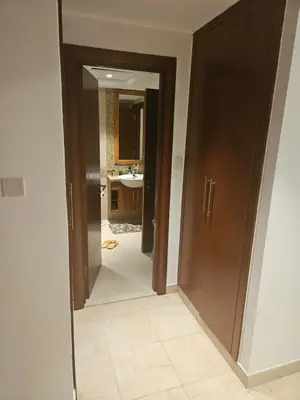 a hallway with a door leading to a bathroom at Fairways north in Dubai