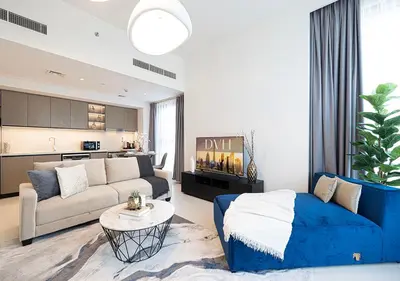a living room with a couch and a table at Lux Escape, Burj Crown Opera View, Near Dubai Mall in Dubai