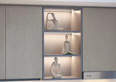 a display cabinet with three figurines of a woman on display at Lux Escape, Burj Crown Opera View, Near Dubai Mall in Dubai