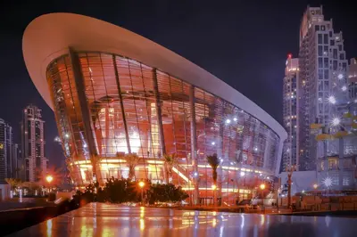 a large building in a city at night at Lux Escape, Burj Crown Opera View, Near Dubai Mall in Dubai