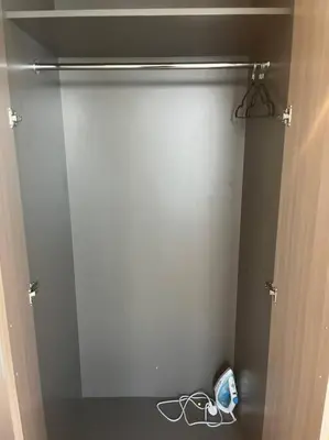 a closet with a door open with aconnected at The Perfect Couples Nest in Dubai