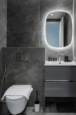 a bathroom with a sink and a toilet and a mirror at Al Andalus Tower F, Cadiz JGE - 3BR Apartment - Allsopp & Allsopp in Dubai