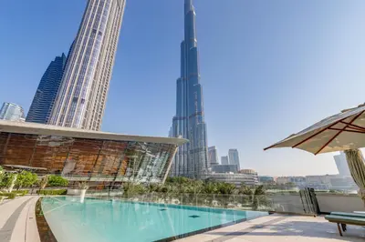 a swimming pool with a view of the city at Knokey Luxury 1BR Apartments - 5 min walk to Burj Khalifa & Dubai Mall & Dubai Fountain in Dubai