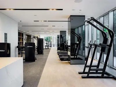 a row of treadmills in a gym with tread machines at Knokey Luxury 1BR Apartments - 5 min walk to Burj Khalifa & Dubai Mall & Dubai Fountain in Dubai