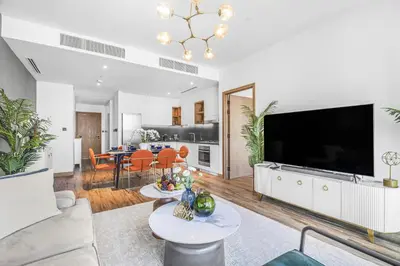 a living room with a large flat screen tv at EDEN'S Homes & Villas - VIDA Dubai Marina Residences in Dubai