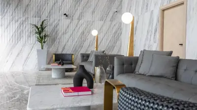 a living room with a couch and a table at Comfy 1br In Al Jaddaf Balcony Parking in Dubai