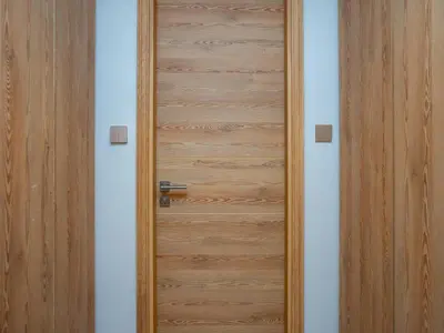 a wooden door in a room at Elgant 2 bedroom in Dubai