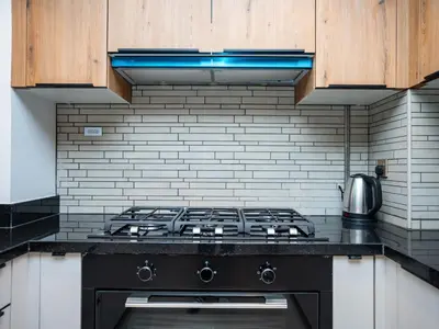 a kitchen with a black stove top oven at Elgant 2 bedroom in Dubai