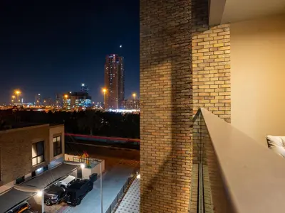 a view of the city at night from a building at Elgant 2 bedroom in Dubai
