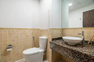 a bathroom with a toilet and a sink at GuestReady - Charming retreat in Dubai Marina in Dubai