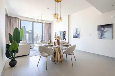 a dining room with a table and chairs at Frank Porter - Forte Tower 1 in Dubai