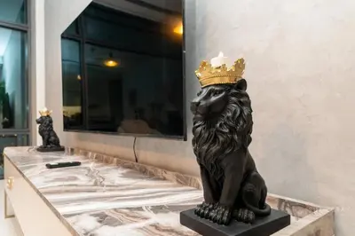 a statue of a lion with a crown on its head at Skyline Burj Facing Suite in Dubai