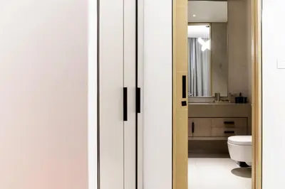 a bathroom with a toilet and a mirror at Panoramic Sea & Palm Views 2BR Address Beach Resort JBR in Dubai