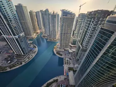 an aerial view of a city with a river at Stunning Apartment - High Floor - Canal View - Goldcrest Exectutive Tower in Dubai