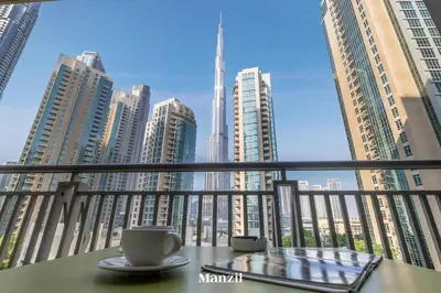 a view of the dubai city from a balcony at Stylish 2BR with Burj Khalifa View near Dubai Mall in Dubai
