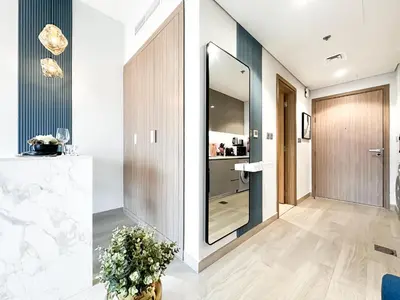a hallway with a large mirror in a building at Meydan Living - Unwavering Excellence in Dubai