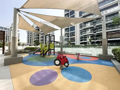 a playground with a toy tractor on a carpet at Meydan Living - Unwavering Excellence in Dubai