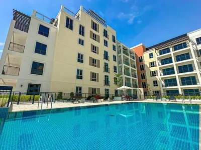 a large swimming pool in front of a building at HiGuests - Beachfront Living Stunning 4 BR with Maid's Room in Dubai