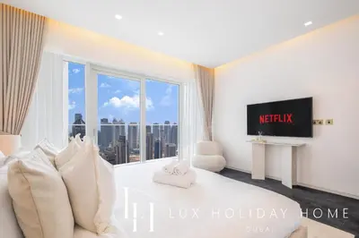 a bedroom with a large window with a city view at LUX Lavish Suite with Full Marina View 4 in Dubai