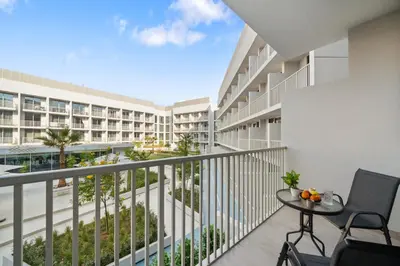 an image of a balcony of a condo building at luxury Santorini studio style in Dubai