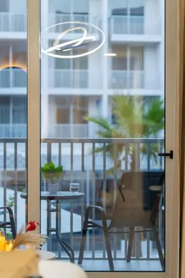 a view of a balcony with a table and chairs at luxury Venice holiday home in Dubai