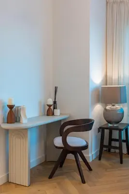 a room with a desk with a chair and a lamp at Marina Royale 3 Bedroom Apartment I Luxe Marina Harbour & Yacht Club Views I Nearby to a Beach I Free Pool, Gym, Wi-Fi and Parking I by Meerak in Dubai