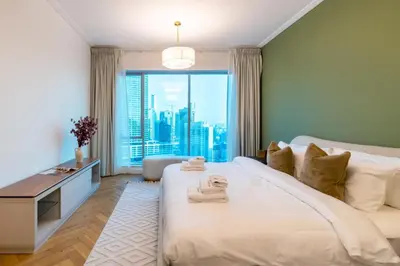 a bedroom with a large bed with a large window at Marina Royale 3 Bedroom Apartment I Luxe Marina Harbour & Yacht Club Views I Nearby to a Beach I Free Pool, Gym, Wi-Fi and Parking I by Meerak in Dubai